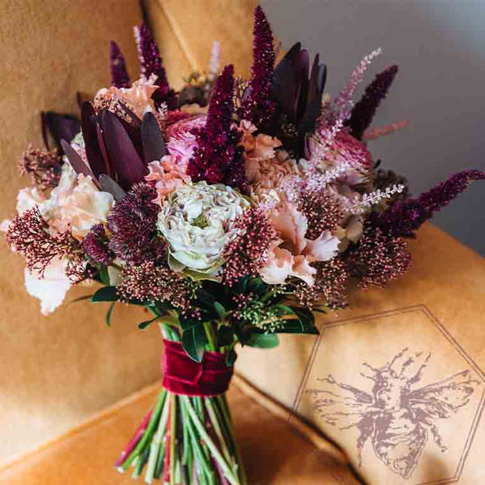 Pastel and deep purple wedding bouquet by The B Nest Studios weddings
