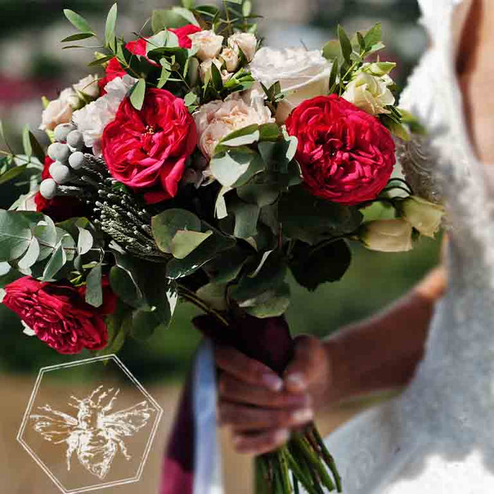 Wedding bouquet featuring red and white roses