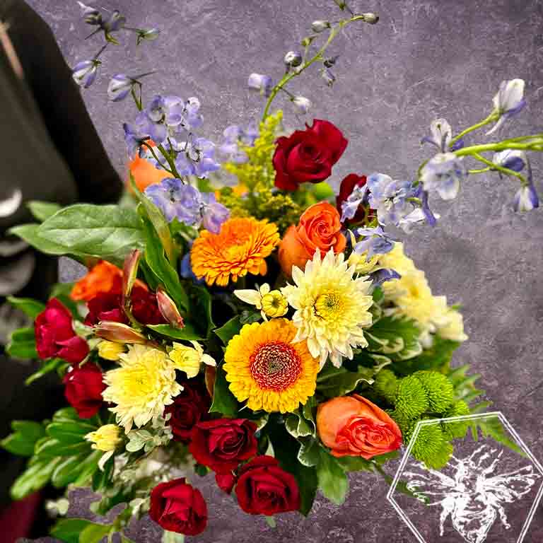 Hand tied fresh cut assortment of beautiful flowers featuring everyone's favorites