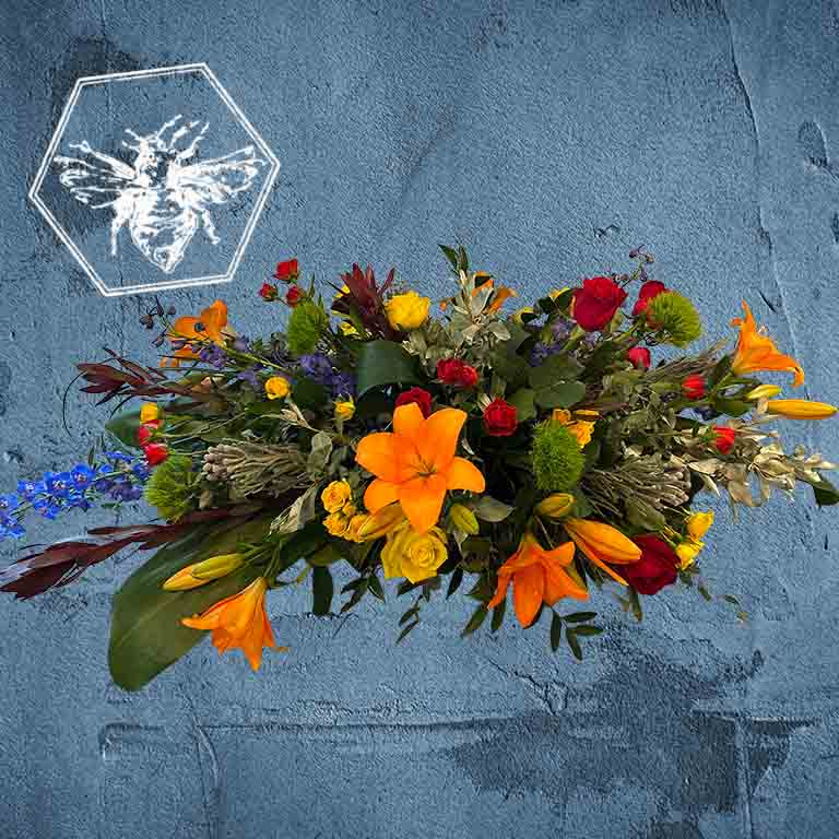 Memorial standing spray that is hand-crafted with absolute care and dignity by our design team, using premium, high-quality blooms to create a stunning, reverent focal piece that honors a unique life and legacy.