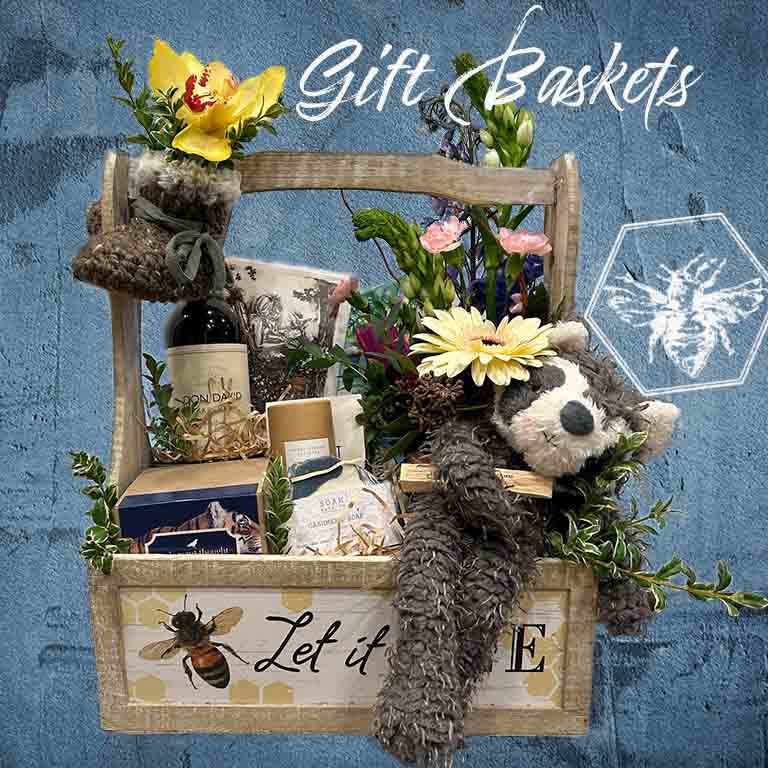 Custom gift basket featuring floral accents and all of your favorite goodies and gifts from The B Nest Studios