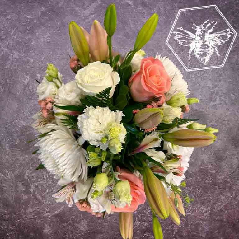 Hand tied fresh cut assortment of beautiful flowers featuring everyone's favorites