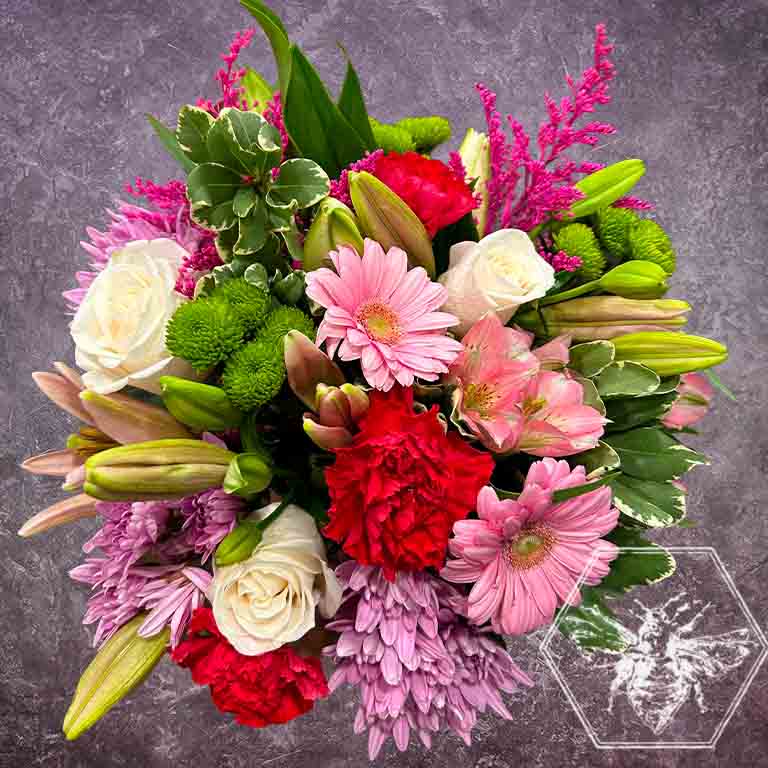 Hand tied fresh cut assortment of beautiful flowers featuring everyone's favorites