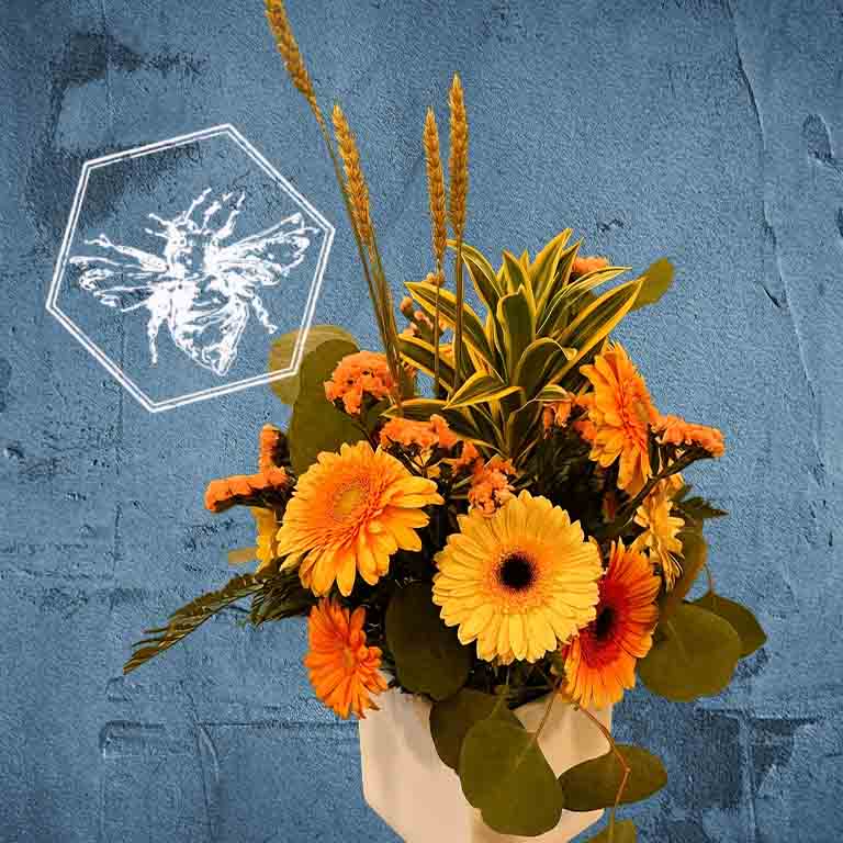 Bouquet of orange and yellow flowers with a bee illustration on a textured blue background