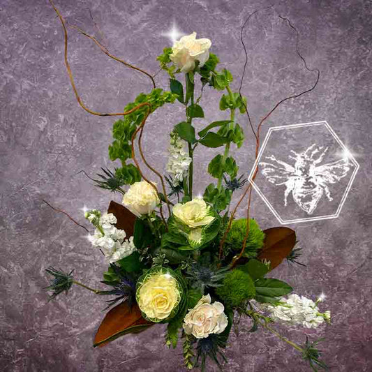 Modern seasonal flower arrangement with elevated feel and luxurious artisanal tone creatively and carefully crafted from the finest flowers and textures representing the season of the year 