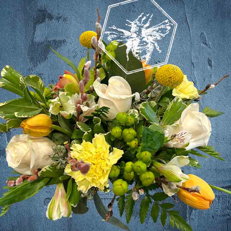 Bouquet of flowers with yellow and white flowers on a blue textured background