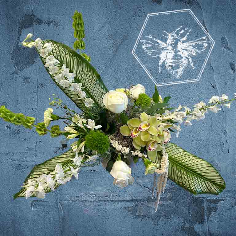 Memorial standing spray that is hand-crafted with absolute care and dignity by our design team, using premium, high-quality blooms to create a stunning, reverent focal piece that honors a unique life and legacy.