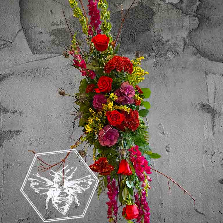 Memorial standing spray that is hand-crafted with absolute care and dignity by our design team, using premium, high-quality blooms to create a stunning, reverent focal piece that honors a unique life and legacy.