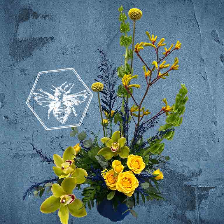 Fresh spring flowers creatively arranged in a ceramic pot with a modern style and luxurious tone with elevated care to every detail 