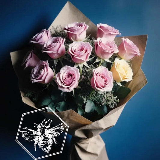 Bouquet of pink roses wrapped in brown paper against a blue background