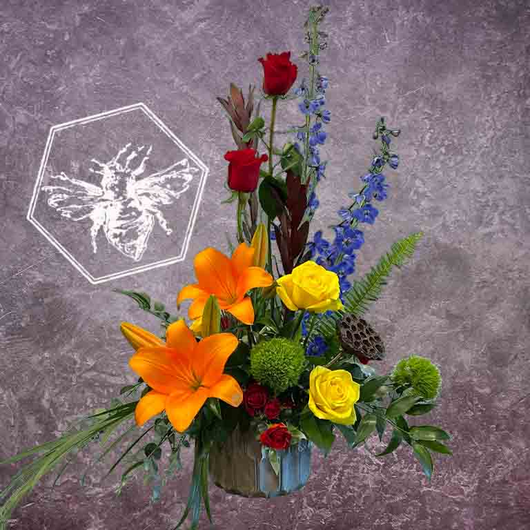 Creative vertical bright and colorful designers choice modern flower arrangement