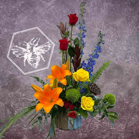 Creative vertical bright and colorful designers choice modern flower arrangement