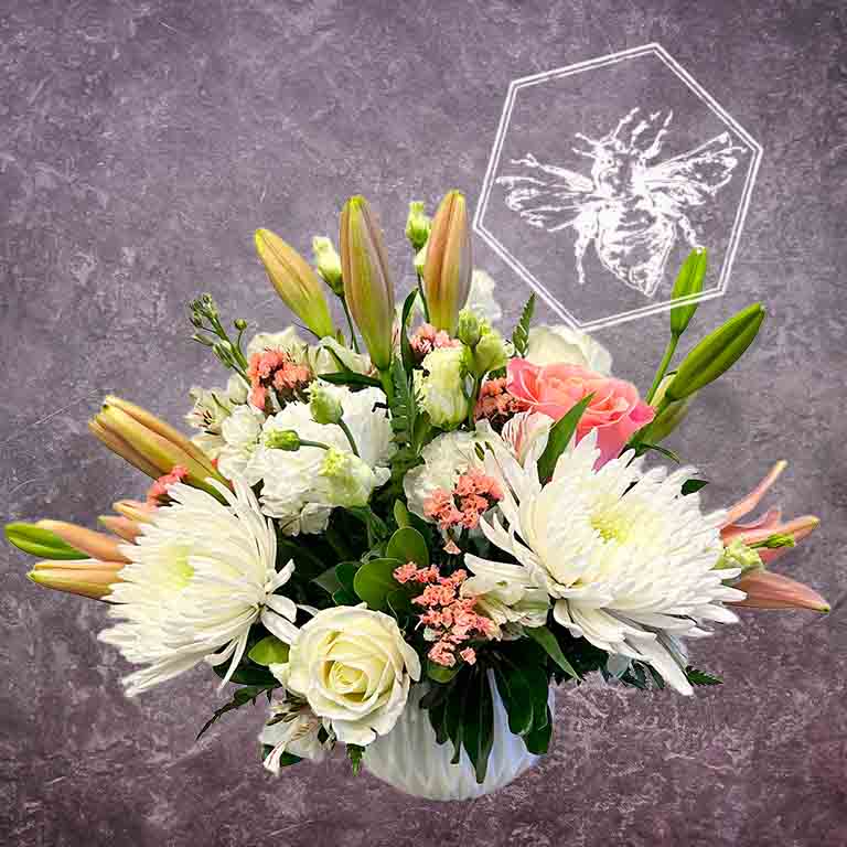 Premium modern arranged designers choice lilies with a creative sophistication and luxurious natural beauty in white and pastel tones
